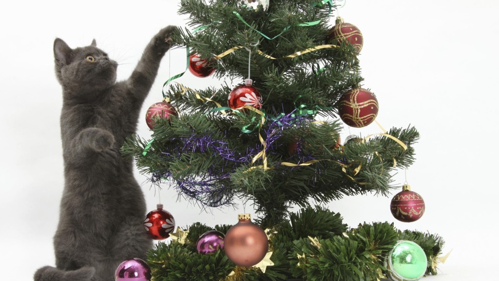 Cat reaching into a Christmas tree