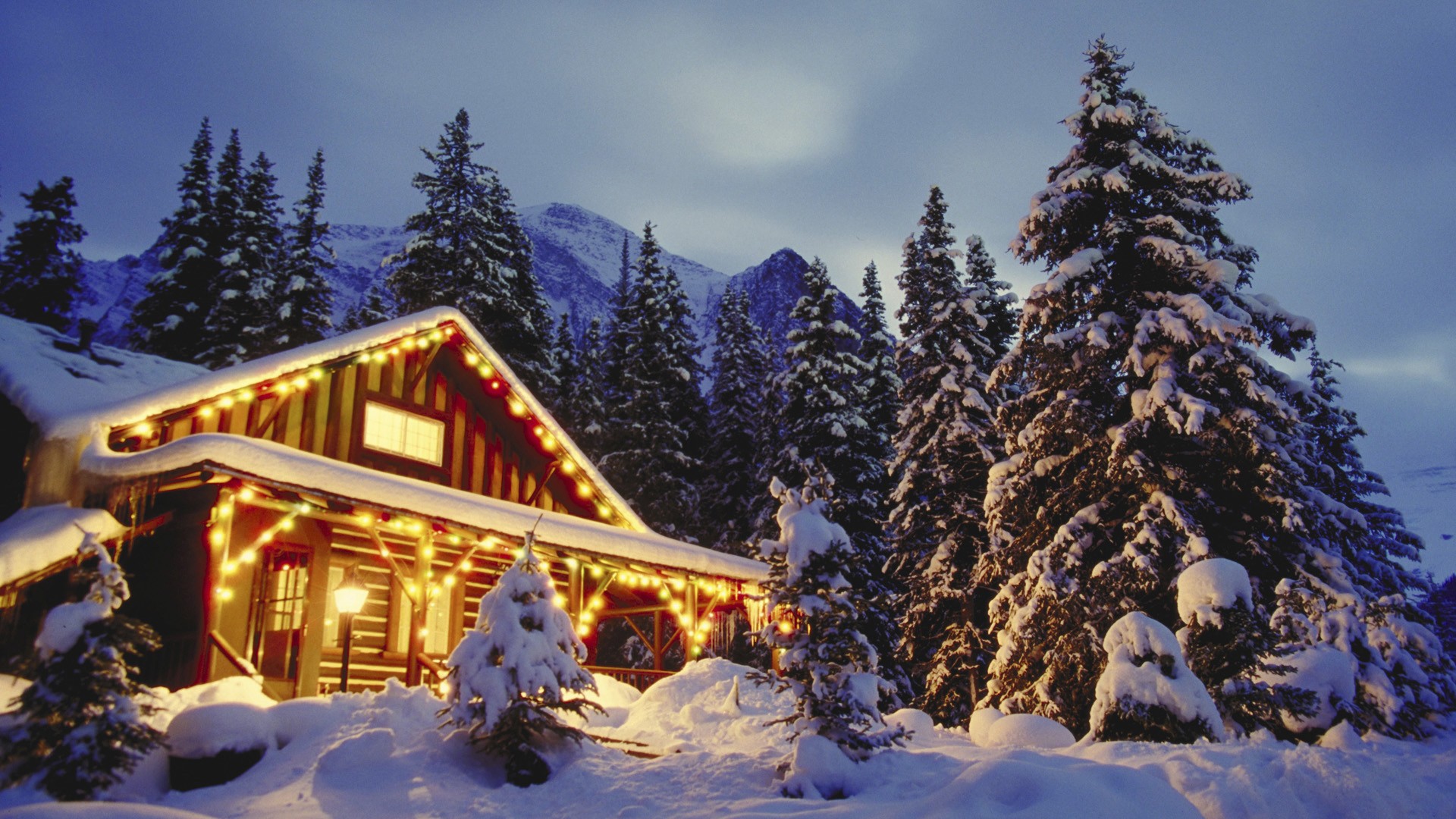 christmas-scene-in-snowy-mountains-wallpaper.jpg